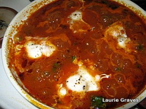 Eggs simmering in sauce