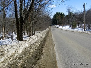 The snow has pulled away from the road