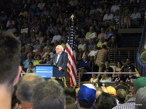 Sanders speaking before the crowd