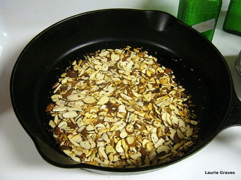 Dry roast the almonds. Flip and watch carefully or else they will burn.