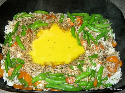 Add the beaten eggs, let cook and set, and then scramble it into the mixture