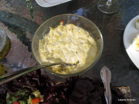 Jill’s luscious artichoke dip next to Alice's beautiful salad.
